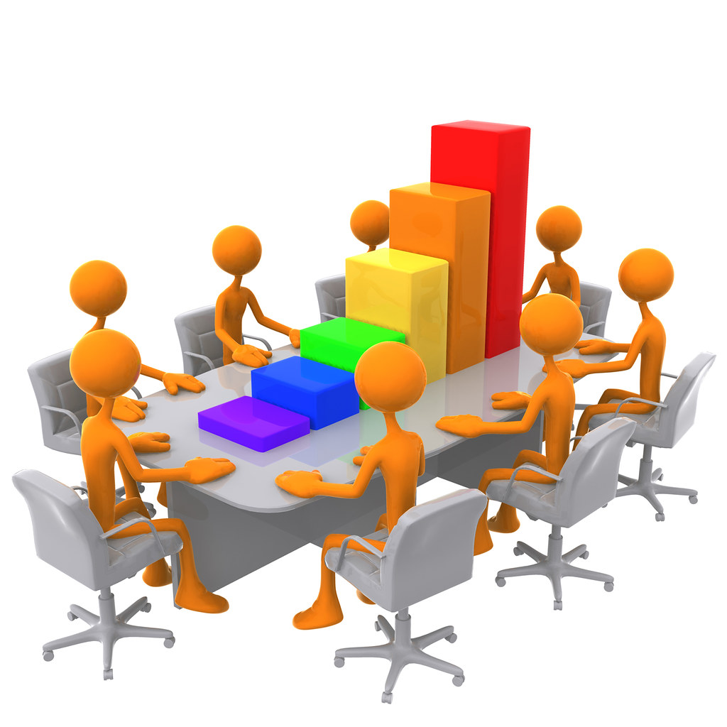 3D bar graph blocks laid out in a meeting, used to compare options visually.